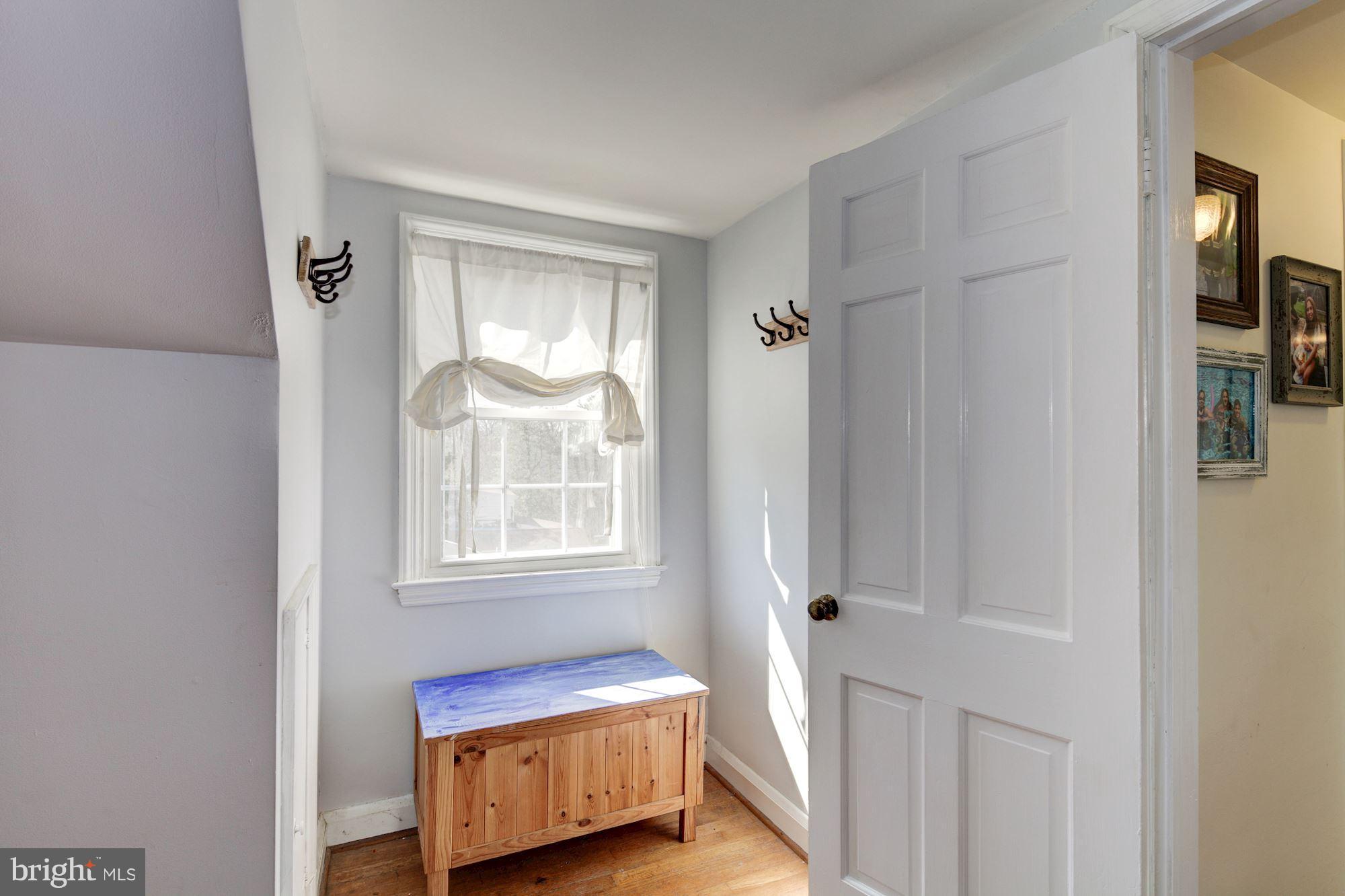 6722 Sherwood Road Baltimore, MD 21239 - Photo 21 of 30 a bedroom with a bed and a window