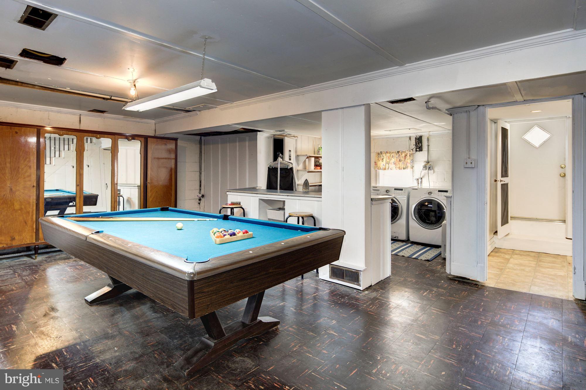 6722 Sherwood Road Baltimore, MD 21239 - Photo 26 of 30 a room with pool table and windows