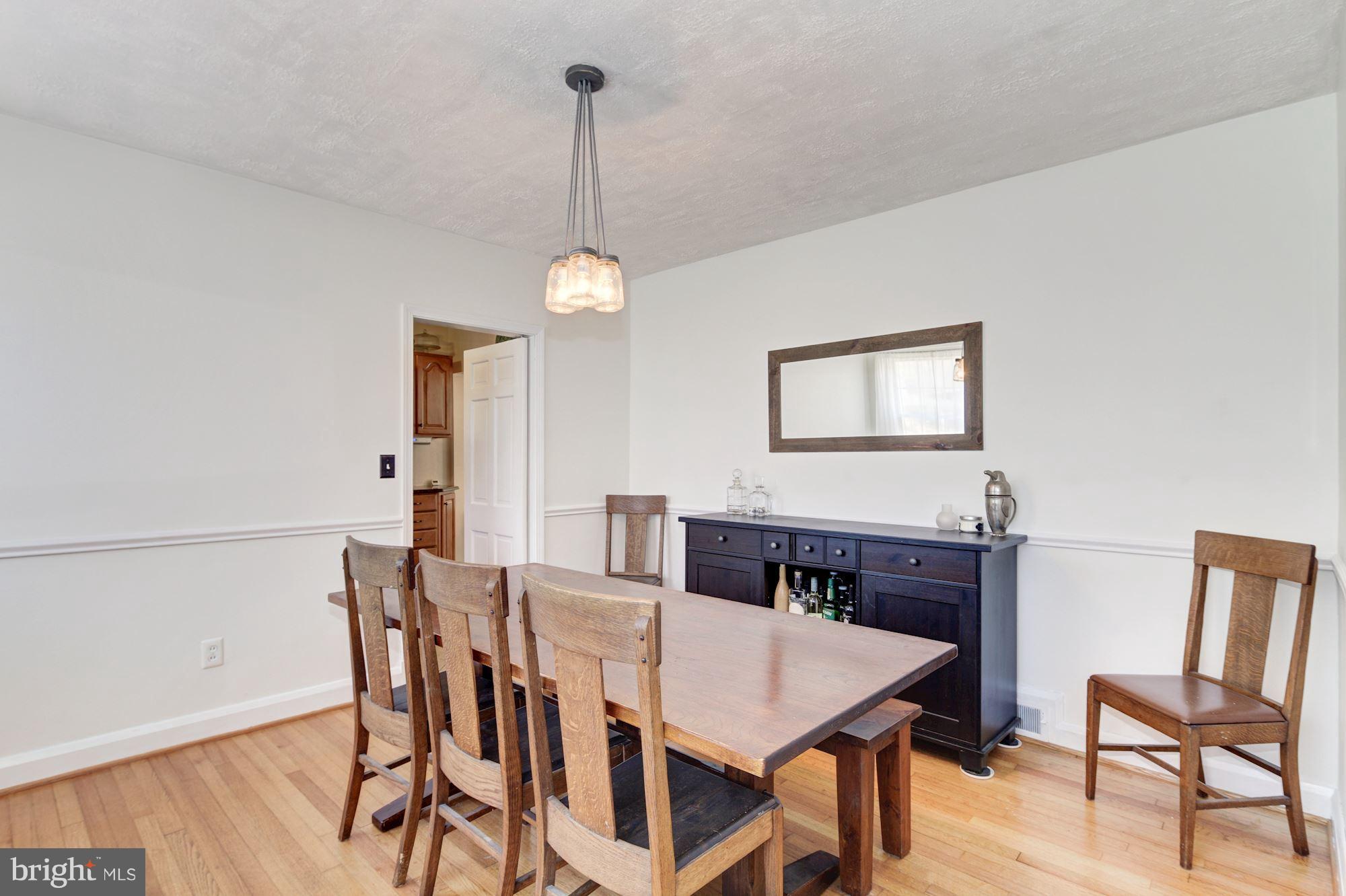 6722 Sherwood Road Baltimore, MD 21239 - Photo 7 of 30 a view of a dining room with furniture