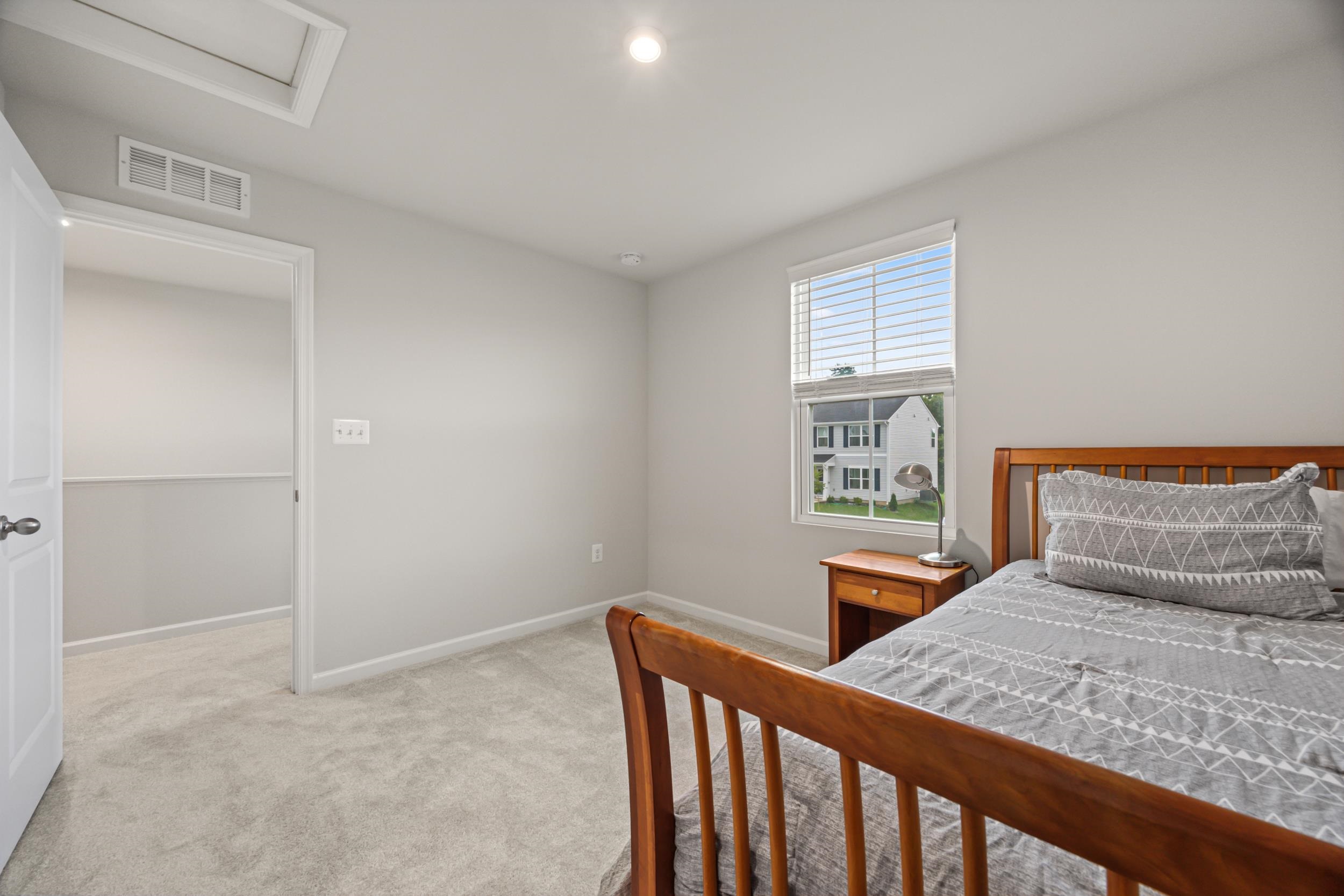 785 Wingtip Way Harrisonburg, VA 22801 - Photo 49 of 75 a bedroom with a bed and wooden floor
