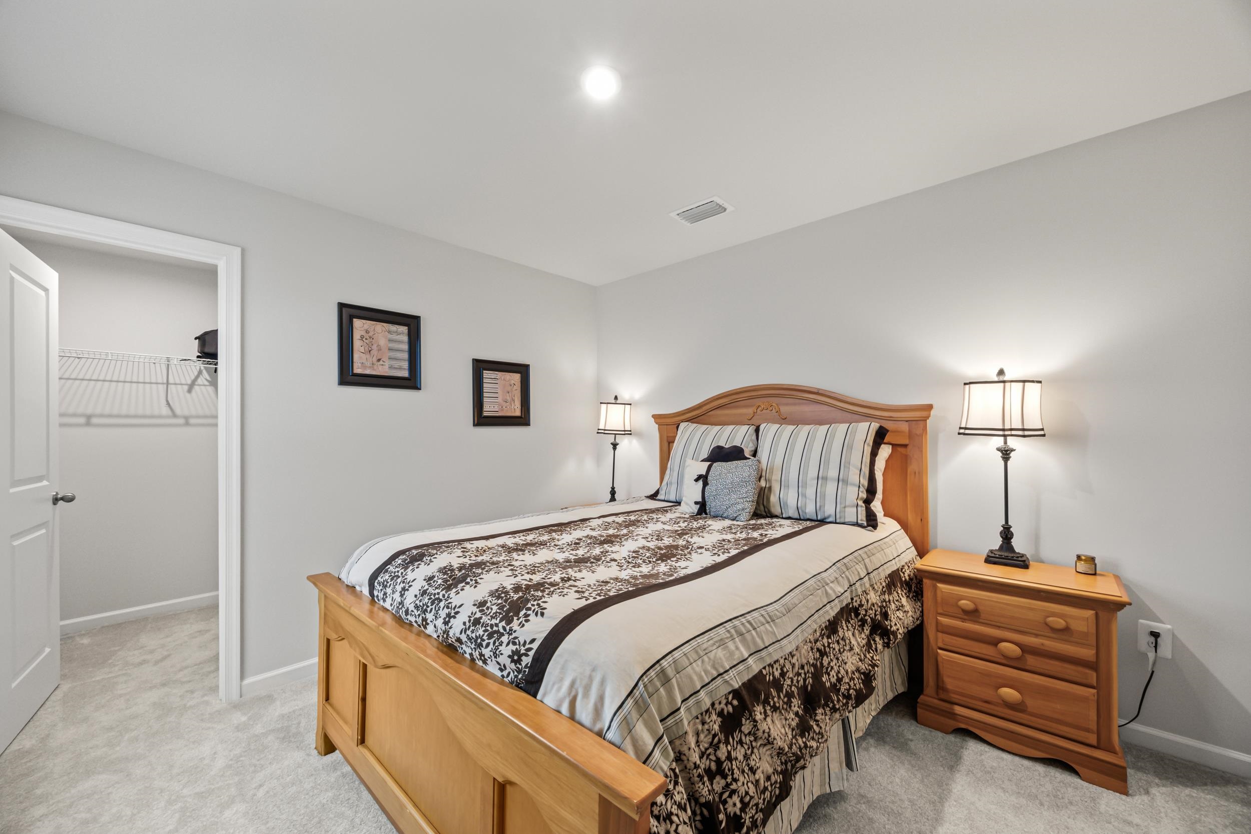 785 Wingtip Way Harrisonburg, VA 22801 - Photo 54 of 75 a bedroom with a bed and a lamp on table