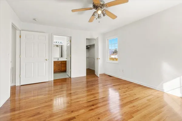 a kitchen with stainless steel appliances a refrigerator and wooden cabinets
