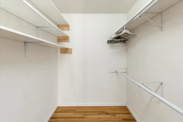 a kitchen with stainless steel appliances a refrigerator sink and microwave