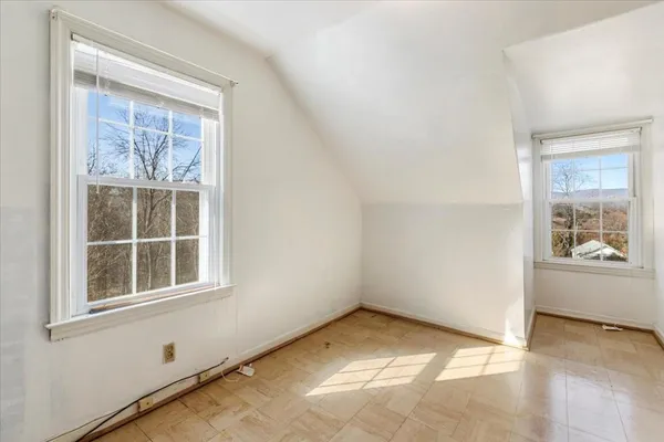 an aerial view of a house with a yard basket ball court and outdoor seating