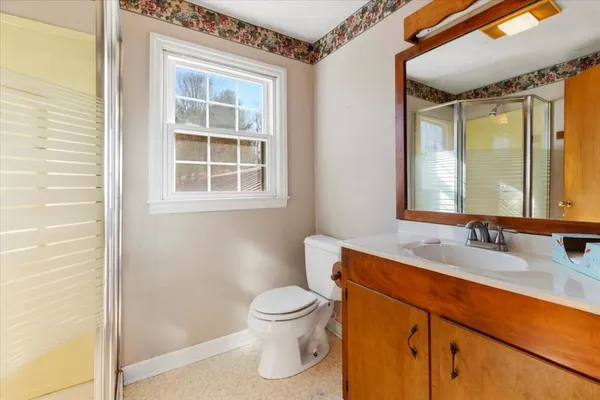 a view of a yard with yellow house