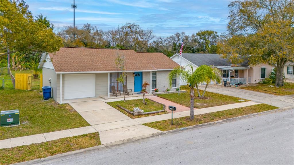 7978 Aden Loop New Port Richey, FL 34655 - Photo 1 of 1 a view of a house with entertaining space and a tree