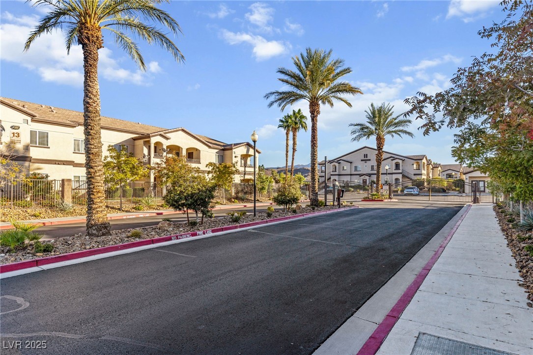 2291 West Horizon Ridge Parkway, Unit 13175 Henderson, NV 89052 - Photo 27 of 29 Gated entry lined with resort-style palm trees for a welcoming first impression