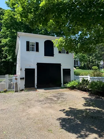 a front view of a house with yard