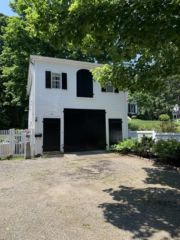 a front view of a house with yard