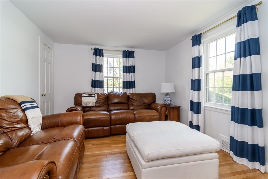 4 Herbert Road Natick, MA 01760 - Photo 9 of 18 a living room with furniture and a floor to ceiling window