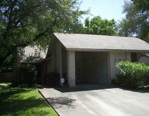 1009 Milford Way Austin, TX 78745 - Photo 1 of 1 a front view of a house with a garden