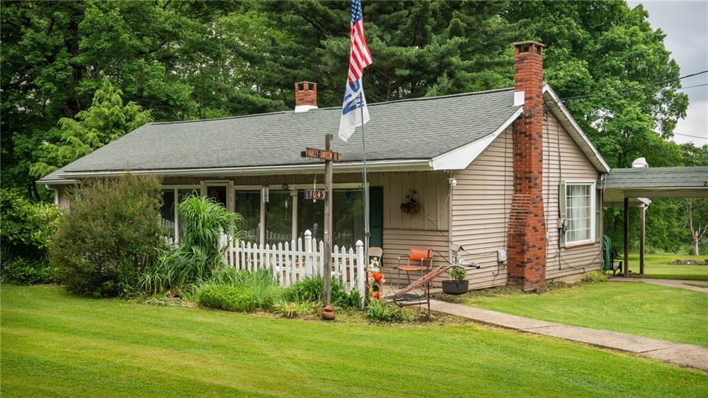 1049 Branchton Road Boyers, PA 16020 - Photo 1 of 22 a house view with a garden and garden