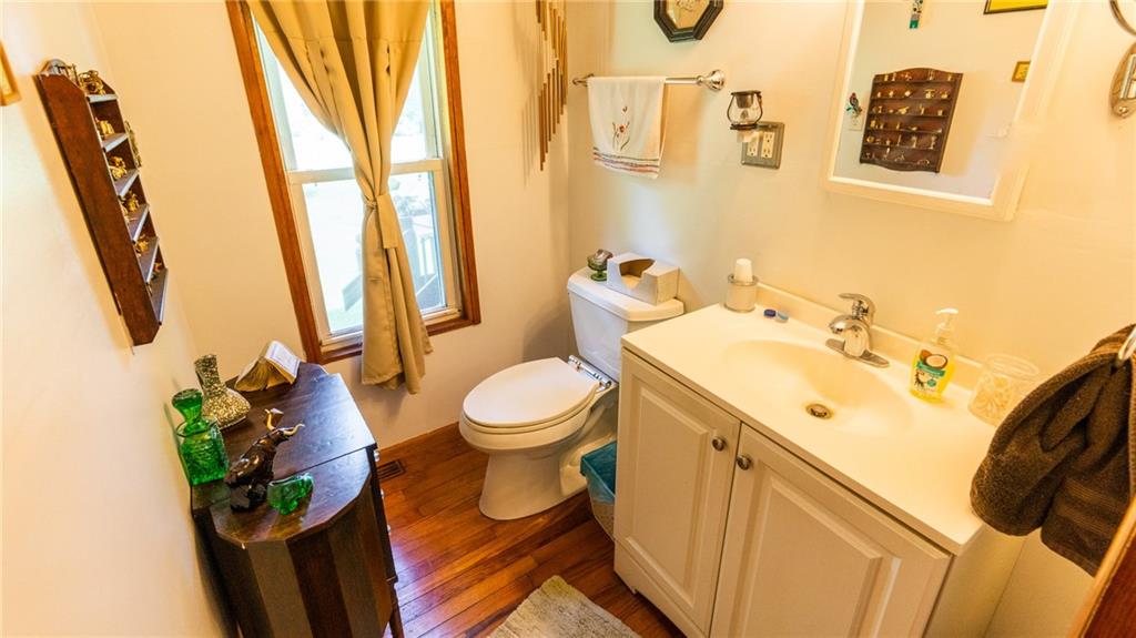 1049 Branchton Road Boyers, PA 16020 - Photo 11 of 22 a bathroom with a sink mirror vanity and toilet