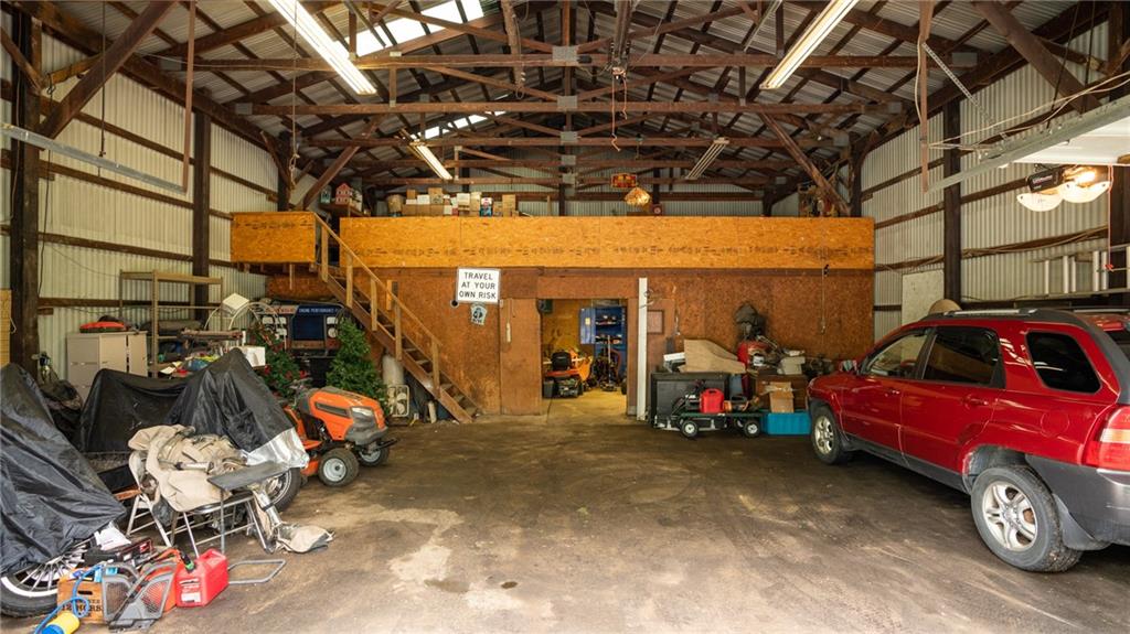 1049 Branchton Road Boyers, PA 16020 - Photo 17 of 22 a view of a garage with a bike and a car parked