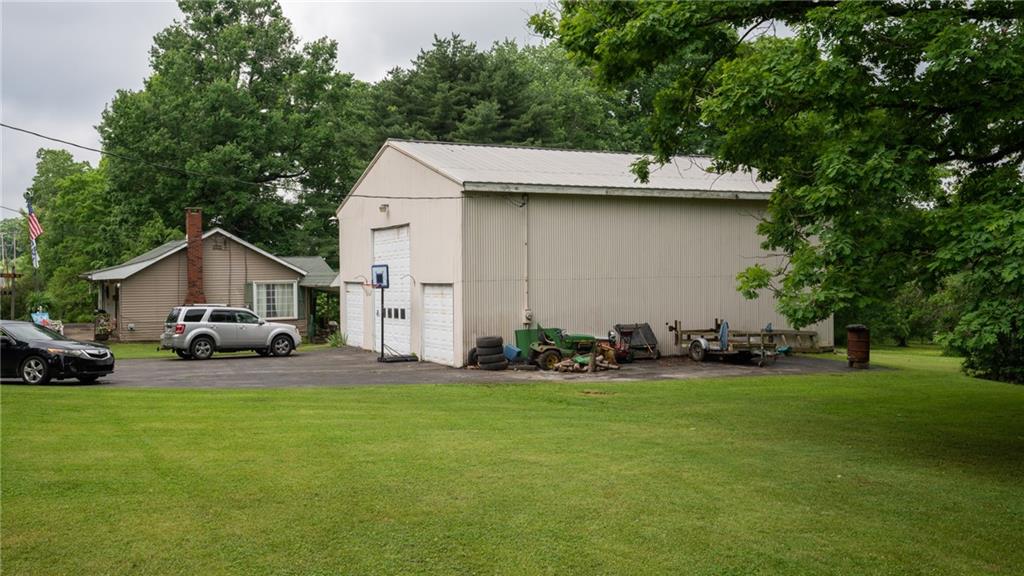 1049 Branchton Road Boyers, PA 16020 - Photo 22 of 22 a view of a house with a yard and garage