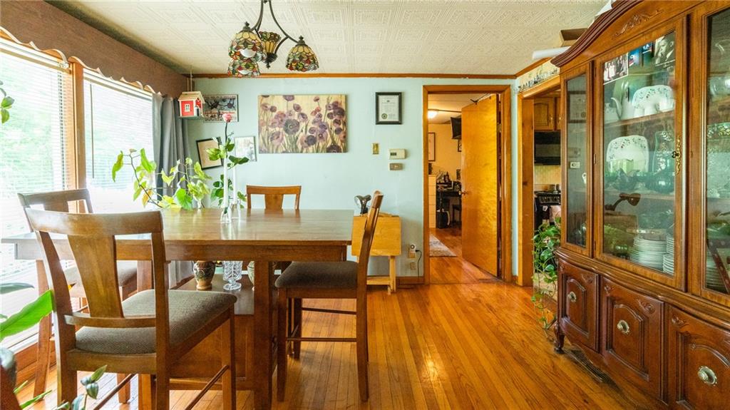 1049 Branchton Road Boyers, PA 16020 - Photo 4 of 22 a dining room with furniture a window and wooden floor