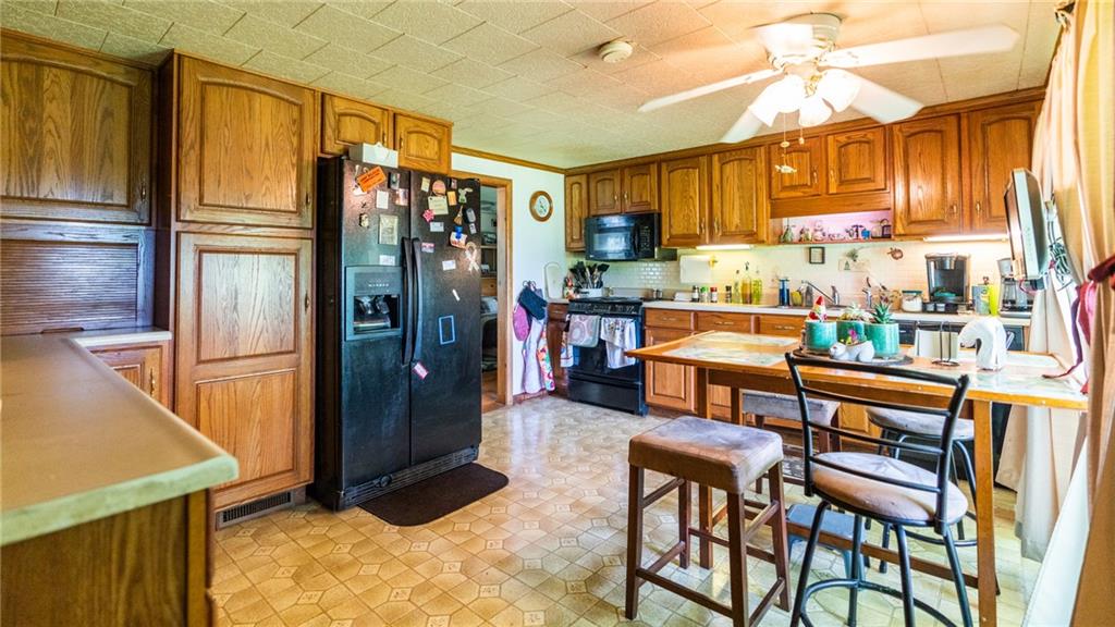 1049 Branchton Road Boyers, PA 16020 - Photo 6 of 22 a kitchen with stainless steel appliances granite countertop a refrigerator and microwave