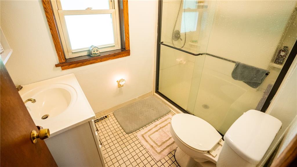 1049 Branchton Road Boyers, PA 16020 - Photo 9 of 22 a bathroom with a toilet sink and mirror