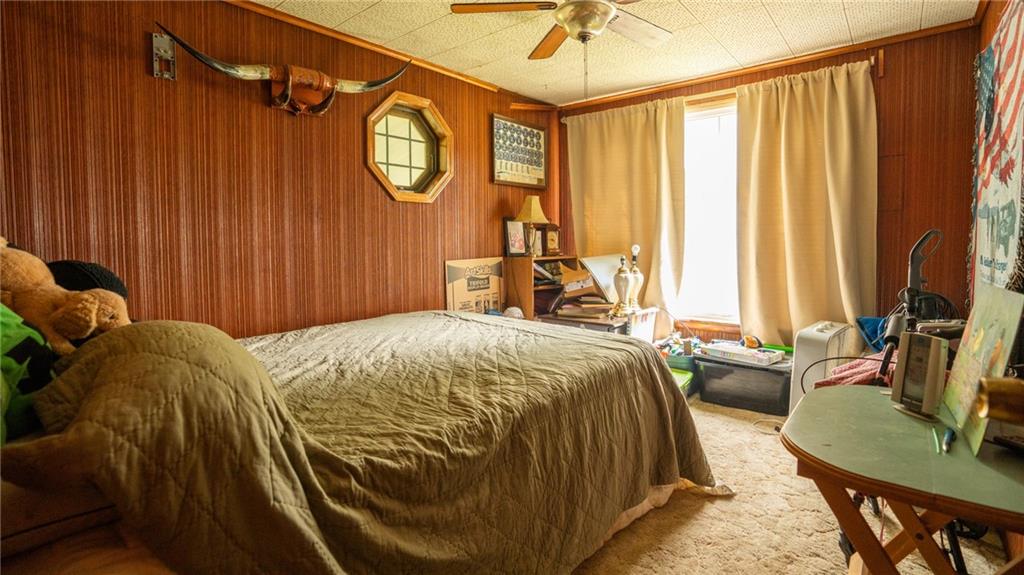 1049 Branchton Road Boyers, PA 16020 - Photo 10 of 22 a bed sitting in a bedroom next to a window