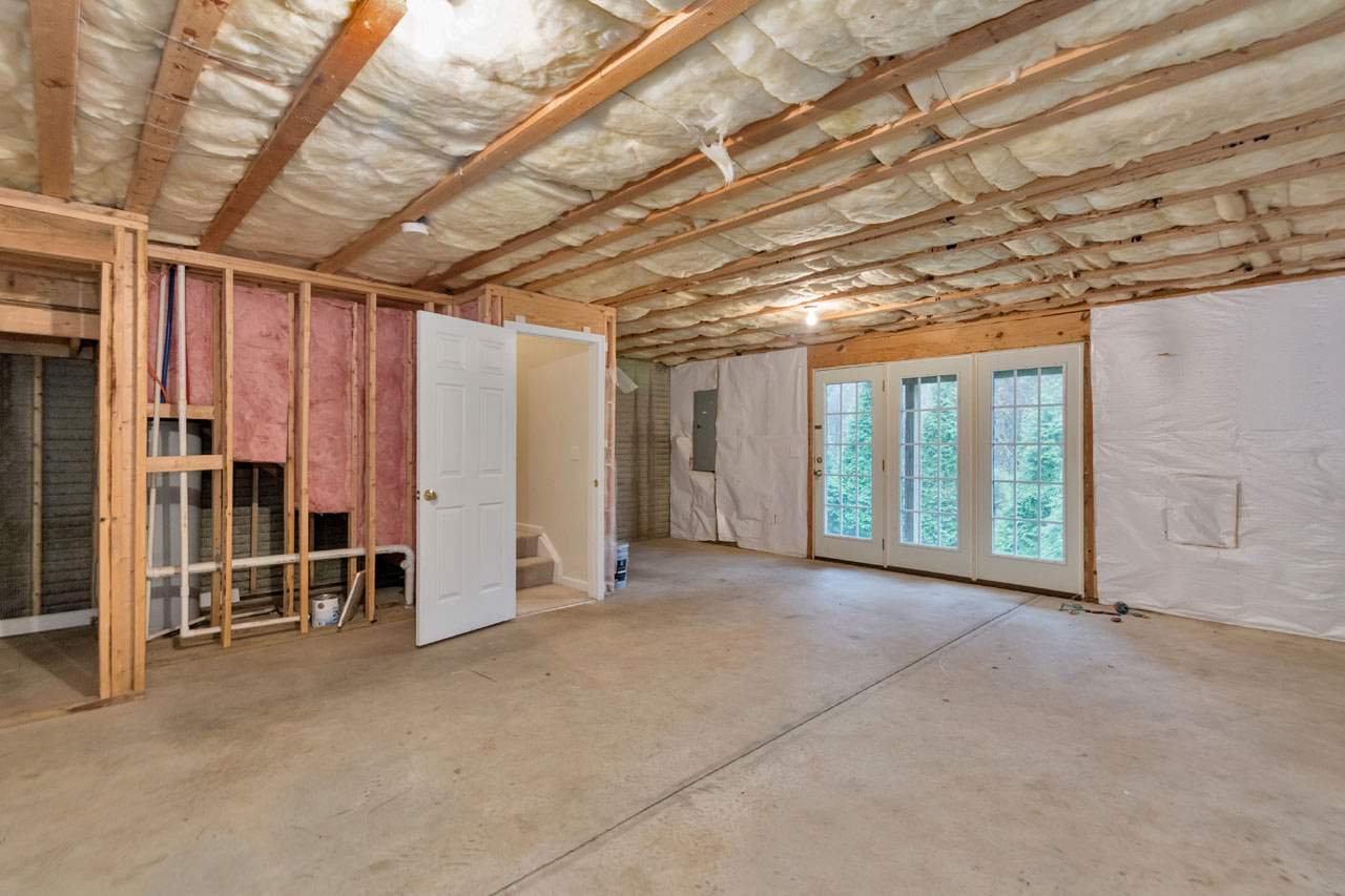 1319 Stoney Ridge Road Charlottesville, VA 22902 - Photo 14 of 17 a view of empty room with wooden walls