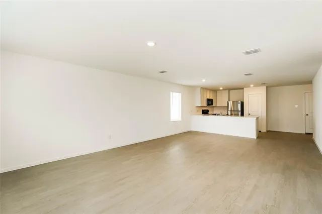 a view of a kitchen with a sink cabinets and a window