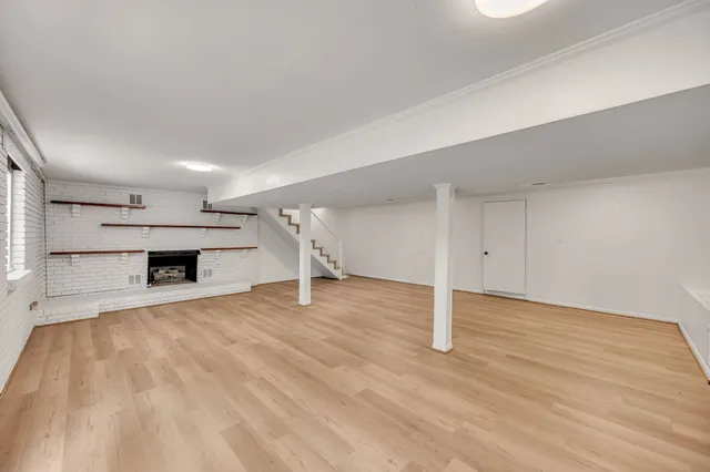 a view of wooden staircase with white walls