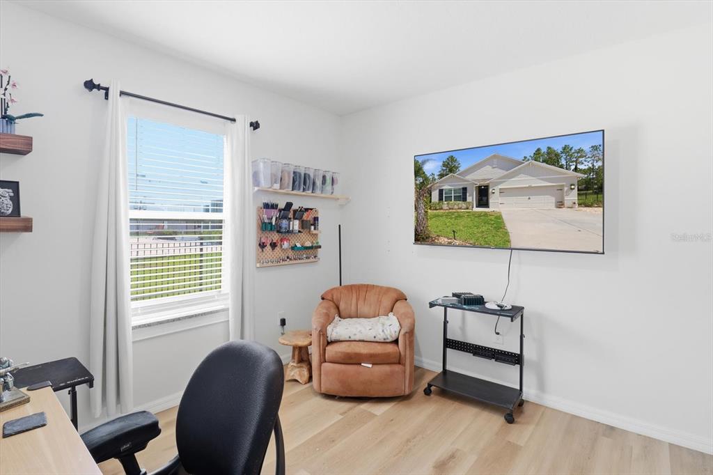 660 Hickory Course Loop Ocala, FL 34472 - Photo 26 of 45 a bedroom with a workspace