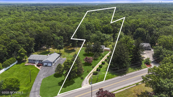 801 Harmony Road Jackson, NJ 08527 - Photo 1 of 1 a view of yard from deck having patio