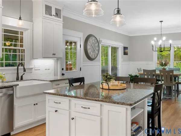 a kitchen with granite countertop living room and living room