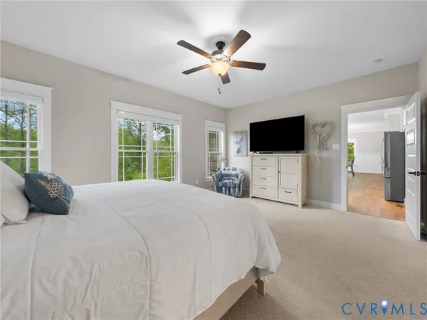 a view of a livingroom with furniture and a flat screen tv