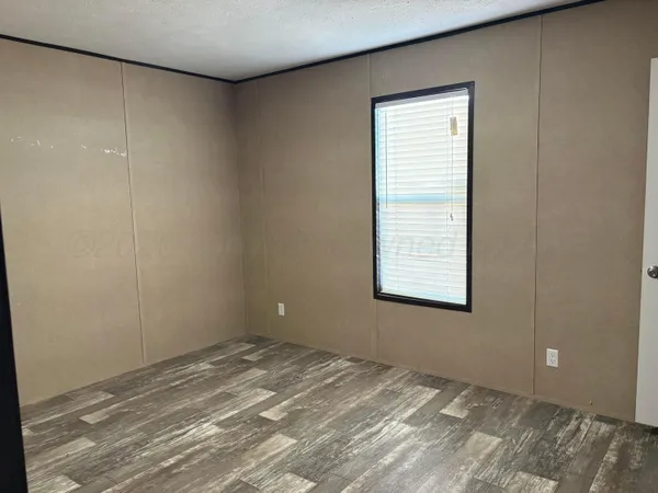 a view of a room that has a window in it