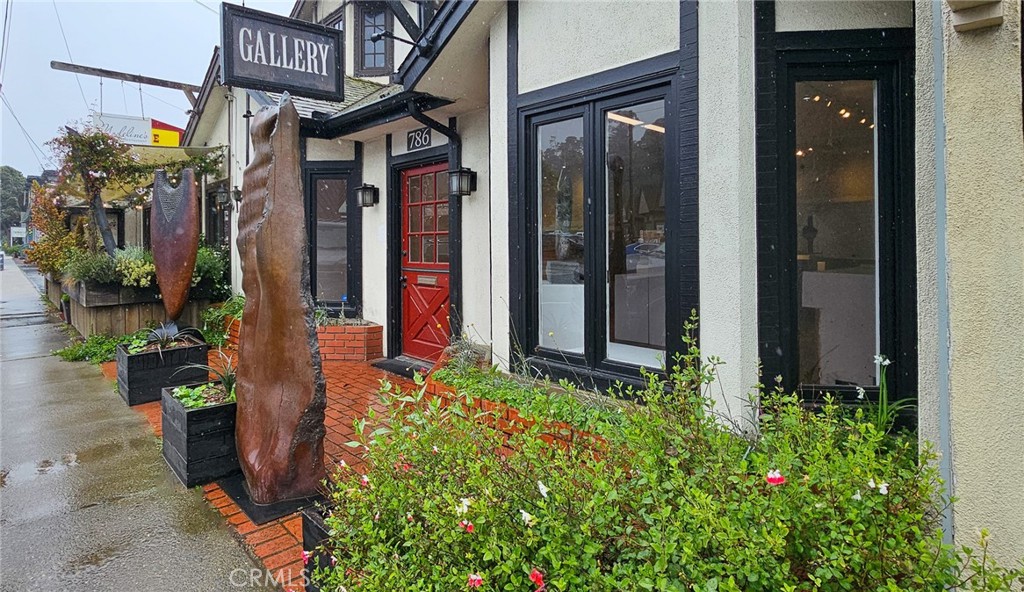 786 Main Street Cambria, CA 93428 - Photo 18 of 36 a view of small house with potted plants