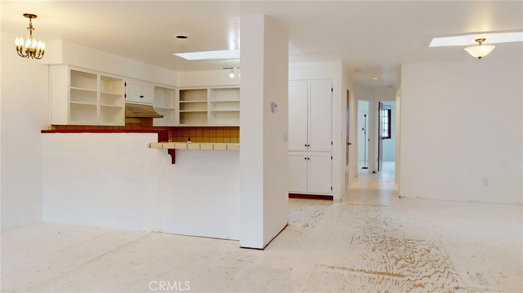 786 Main Street Cambria, CA 93428 - Photo 4 of 36 an empty room with shelves