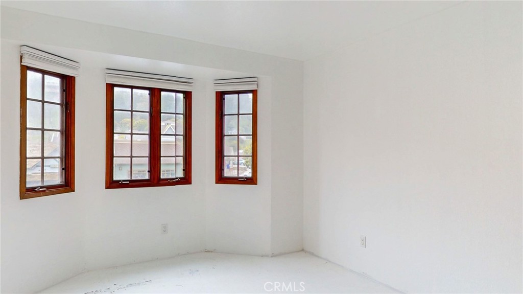 786 Main Street Cambria, CA 93428 - Photo 6 of 36 an empty room with windows