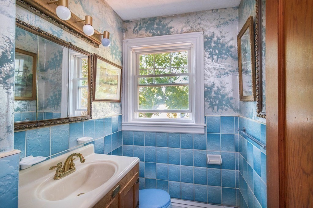 91 Edgewater Road Hull, MA 02045 - Photo 24 of 41 a bathroom with a sink a toilet and shower