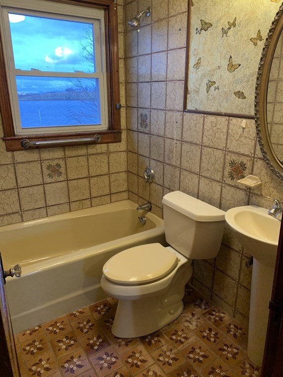 91 Edgewater Road Hull, MA 02045 - Photo 27 of 41 a bathroom with a toilet and a shower