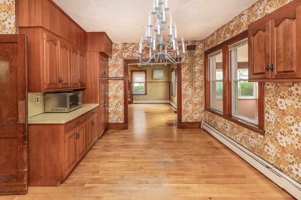 91 Edgewater Road Hull, MA 02045 - Photo 31 of 41 a view of a kitchen with stainless steel appliances granite countertop a stove top oven