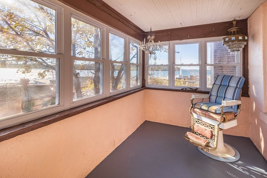 91 Edgewater Road Hull, MA 02045 - Photo 35 of 41 a room with gym equipment and a large window