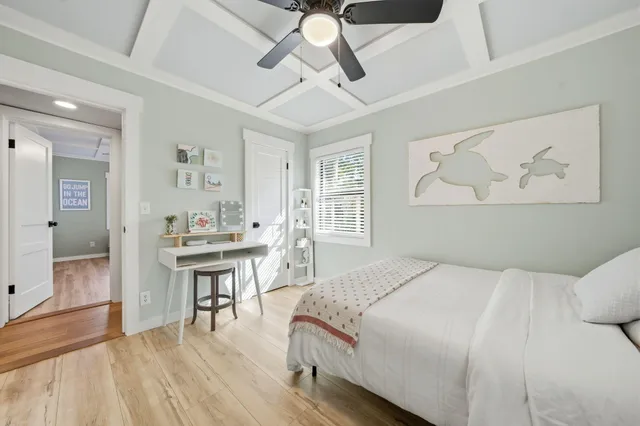 a bedroom with a bed and a table