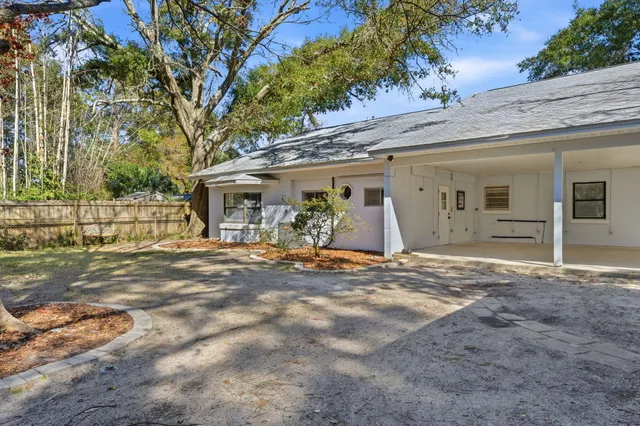 a view of a house with a yard and garage