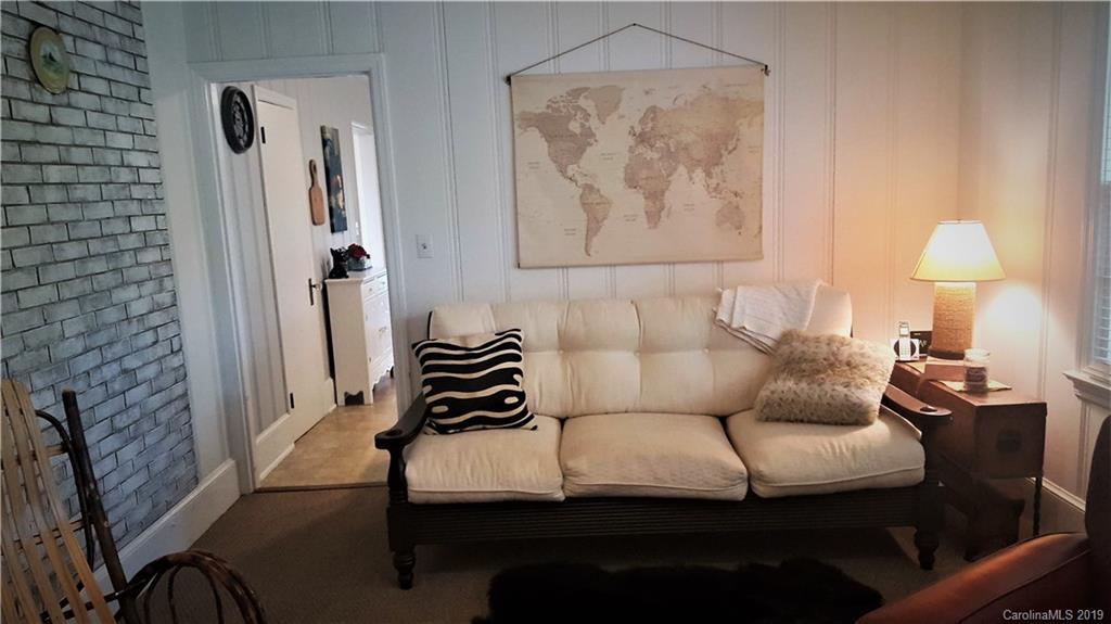 1654 Prince Road Columbus, NC 28722 - Photo 12 of 29 a living room with furniture and a wall painting