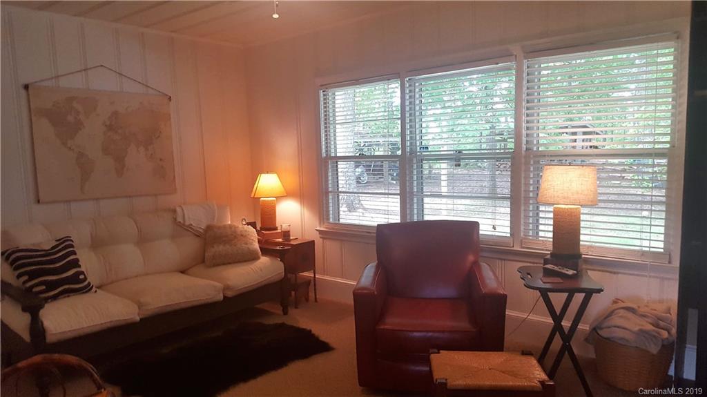 1654 Prince Road Columbus, NC 28722 - Photo 13 of 29 a living room with furniture and a lamp