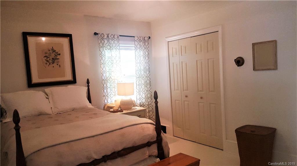 1654 Prince Road Columbus, NC 28722 - Photo 19 of 29 a bedroom with a bed and a window