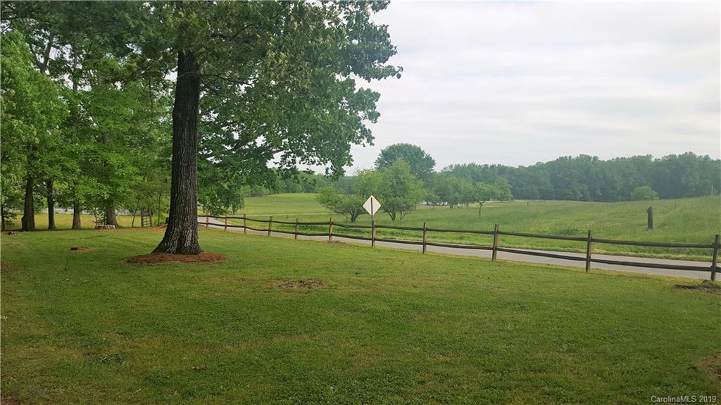 1654 Prince Road Columbus, NC 28722 - Photo 20 of 29 a view of outdoor space with green field and trees