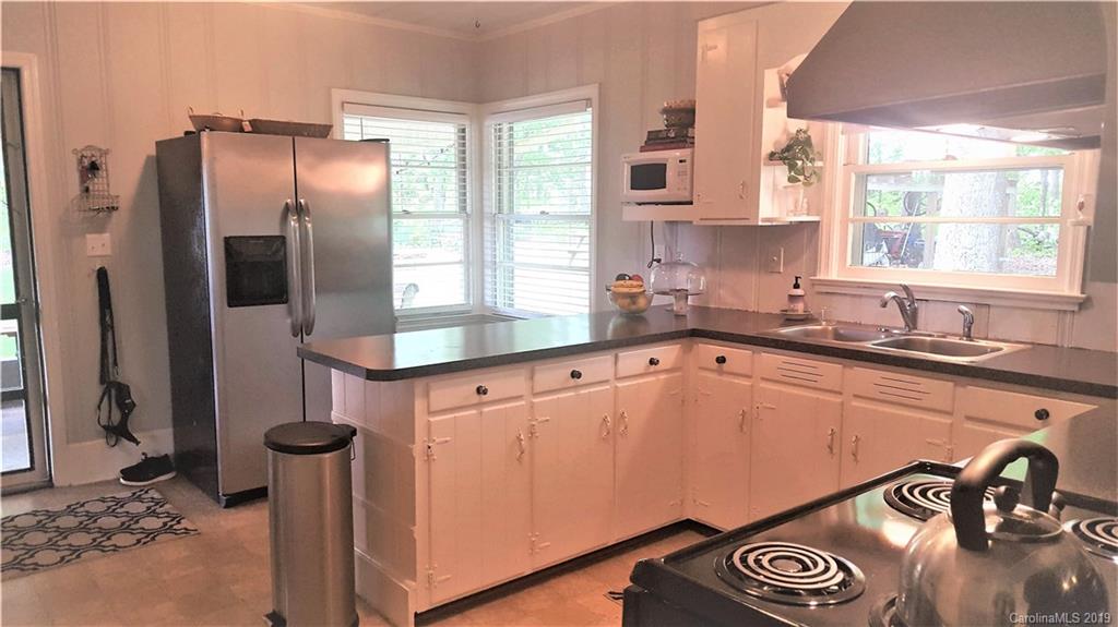 1654 Prince Road Columbus, NC 28722 - Photo 3 of 29 a kitchen with a refrigerator and a sink
