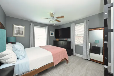 a bedroom with a bed and a glass door