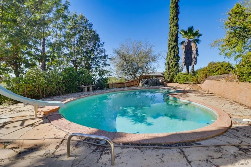602 Starbright Lane Alpine, CA 91901 - Photo 15 of 73 a view of a swimming pool with a yard