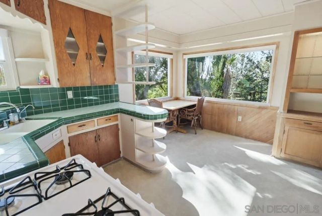 a bathroom with a shower a sink and a shower