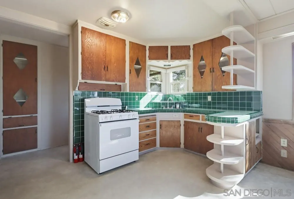 602 Starbright Lane Alpine, CA 91901 - Photo 24 of 73 a kitchen with stainless steel appliances granite countertop a stove and a sink