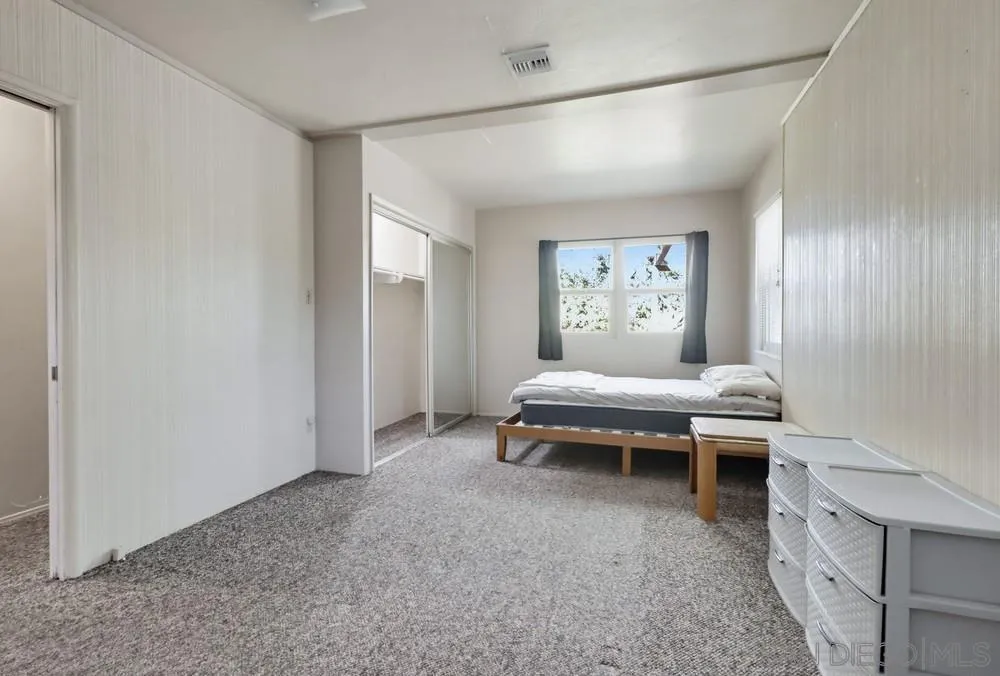 602 Starbright Lane Alpine, CA 91901 - Photo 26 of 73 a bedroom with a bed and a painting on the wall